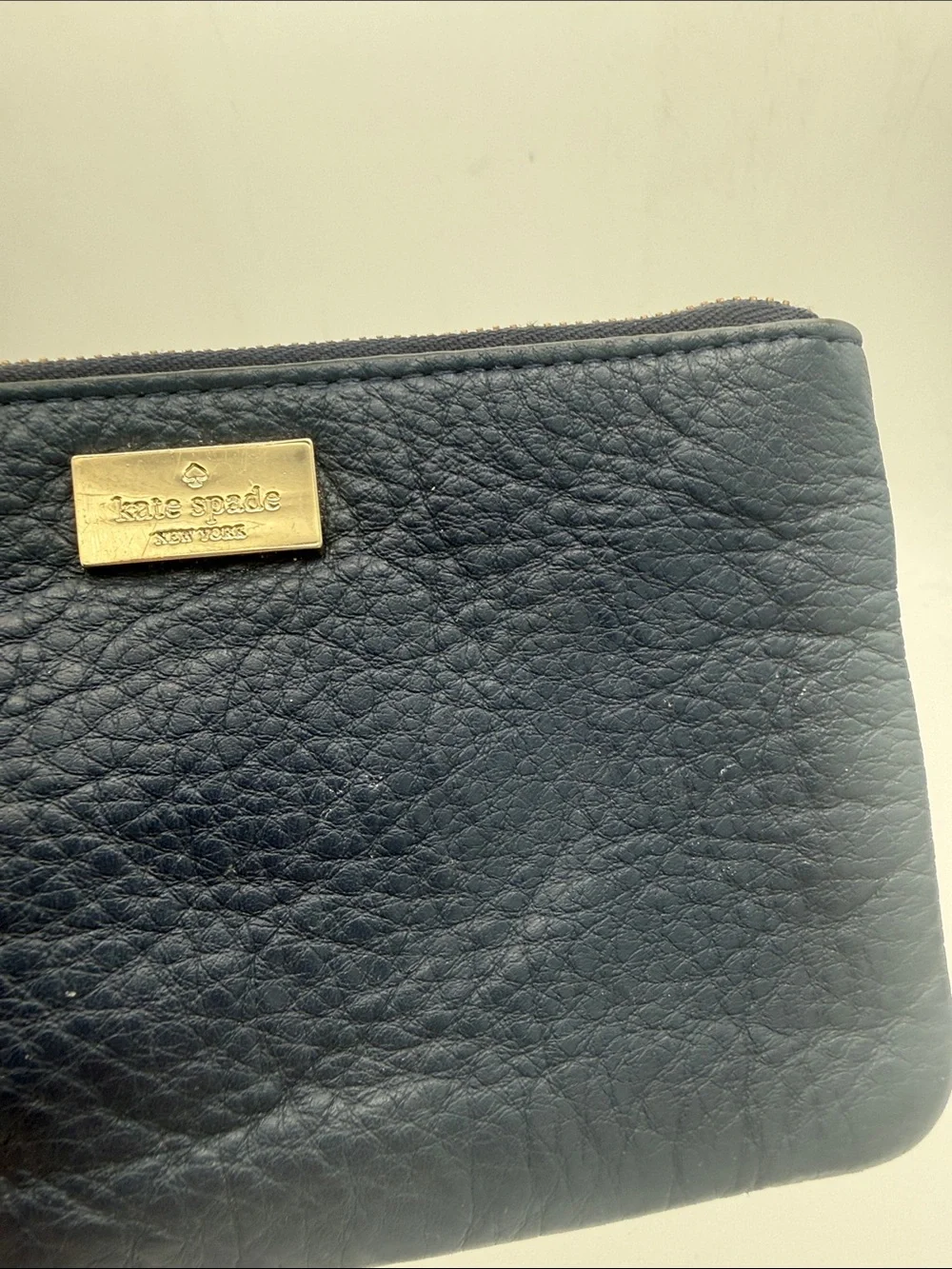 kate spade navy pebbled leather wristlet wi/  gold logo 6.5x4”